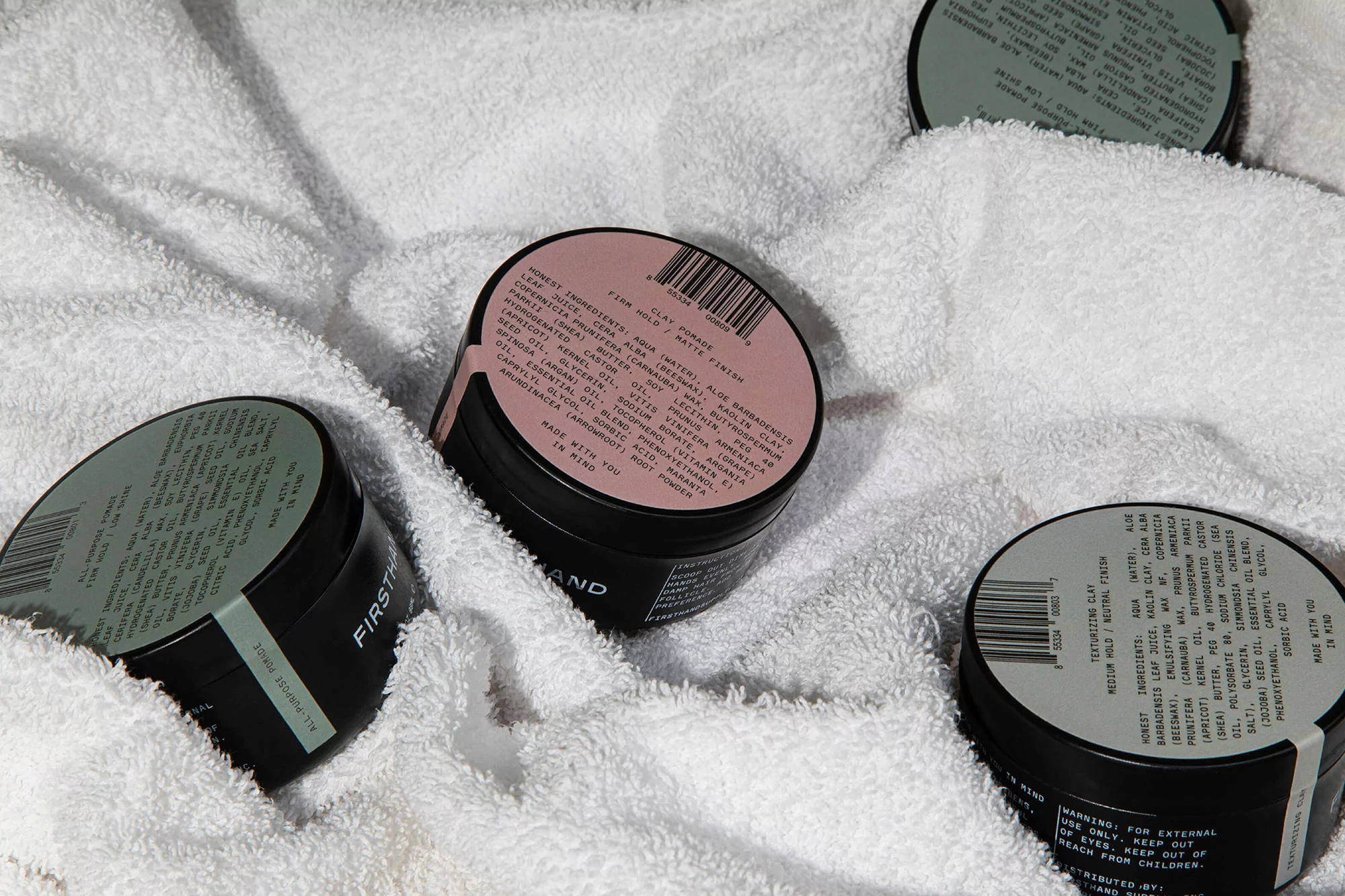 Parker's identity for Firsthand captures the cosmetics brand's industrial and humanitarian qualities